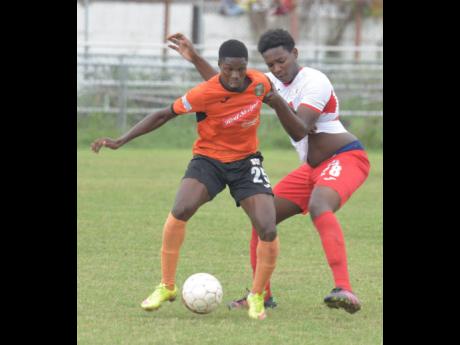 Former Tivoli Gardens player Colorado Murray (left) getting the better of Kurt Thomas (right) from Boys’ Town in a Red Stripe Premier League in 2017.
