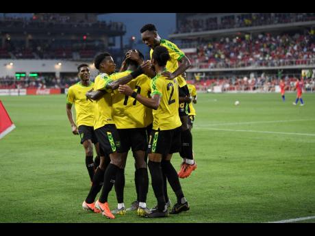 Credit: Nick Wass Jamaica forward Shamar Nicholson (11) celebrates his goal with his teammates during the second half of the team’s international friendly match against the United States, on Wednesday, June 5, 2019.