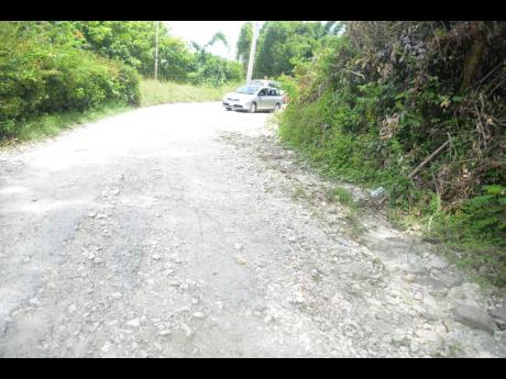 Credit: Albert Ferguson Motorists navigate their way carefully along the road.
