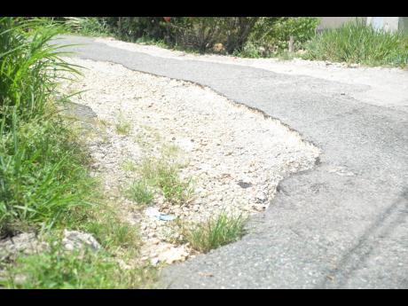 Credit: Albert Ferguson Residents have had to contend with roads like this for years.