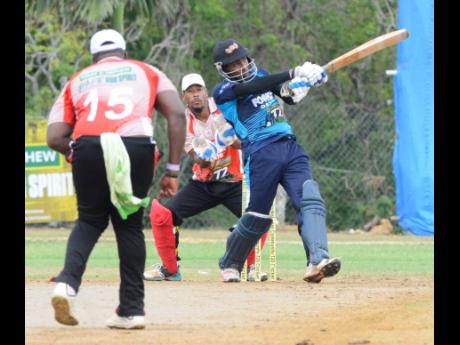 Johnson Mountain’s Gavaskar Malachi hits a six against the White River Rebels during the third-place play-offs of the SDC/Wray & Nephew National Community T20 Cricket competition.