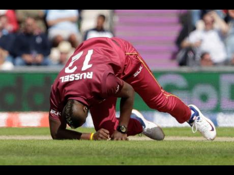 Credit: AP West Indies’ Andre Russell gets up before walking off the field of play with an injury after bowling during the Cricket World Cup match between England and West Indies at the Hampshire Bowl in Southampton, England, on June 14, 2019.