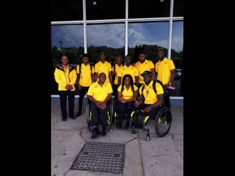 Members of the Para Pan Am delegation (seated from left) Neville Sinclair, sport manager; Santana Campbell; and Navrado Griffiths   (standing from left)  Dr Leroy Harrison, team doctor; Chadwick Campbell, team captain; Jason Brown; Tevaughn Thomas; Jason Ricketts; Theadore Subba; and Shane Hudson ahead of their departure to the games in Lima, Peru.