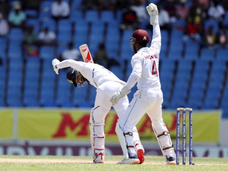 West Indies’ Shai Hope celebrates the dismissal of India’s KL Rahul during day one of the first Test cricket match at the Sir Vivian Richards cricket ground.