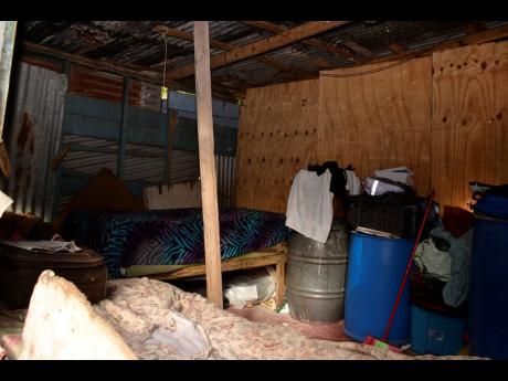 A two-room board house is in need of attention.