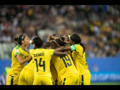Havana Solaun (obscured)  celebrates with Reggae Girlz team-mates moments after scoring the team's first goal in competition in the Jamaica vs Australia fixture of the FIFA Women's World Cup 2019 at Stade des Alpes in Grenoble, France on Tuesday June 18, 2019. 