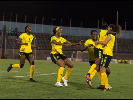 Jamaica’s Marlo Sweatman (right) celebrates a goal with teammates during the Reggae Girlz international friendly against Chile at the National Stadium on February 28, 2019.