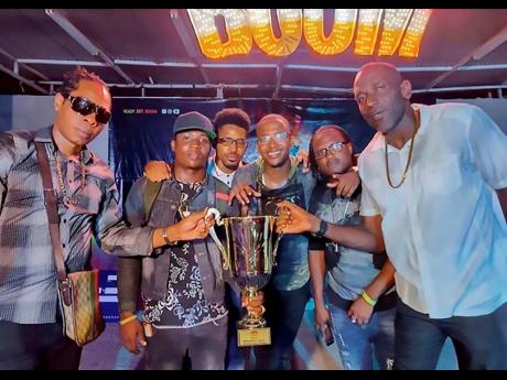 Members of Di Unit (from left)  New Kidz, Niney, DJ Jerome, Badda Bling, Likkle Rich, and Tall Boss celebrate their win.