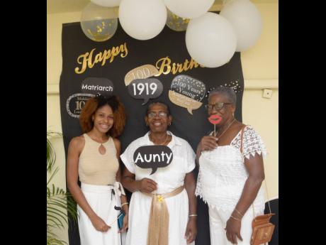From left: Jamie Gibbs-Walters (great-grand niece), Cherry Mussington (niece) and Evelyn Palmer (niece) of centenarian Dorothy Austin pose for a photo ahead of birthday celebrations at the Medallion Hall Hotel.