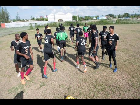 Members of Falmouth United Football team train at the team’s home field, the Elletson Wakeland Centre in Falmouth, Trelawny, on Wednesday.
