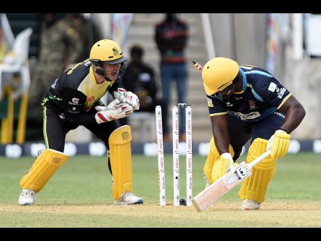 Barbados Tridents batsman Roshon Primus (right) is stumped by Glenn Phillips of the Jamaica Tallawahs during their Caribbean Premier League match at Sabina Park on Sunday, September 15.