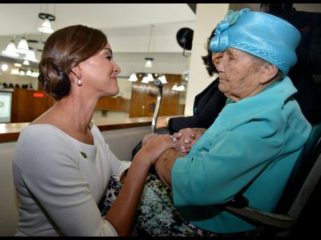 Member of Parliament for Portland Eastern Ann-Marie Vaz shares a touching moment with her grandmother.