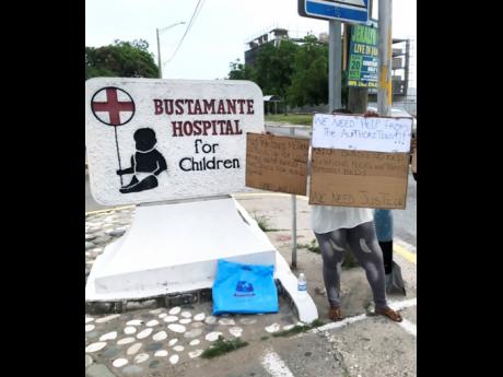 Camille Bowen protesting in front of the Bustamante Hospital for Children last Friday.