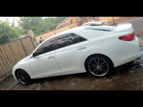 This white 2011 Mark X was reportedly stolen from DJ Ruxie’s Kingston residence last week. 
