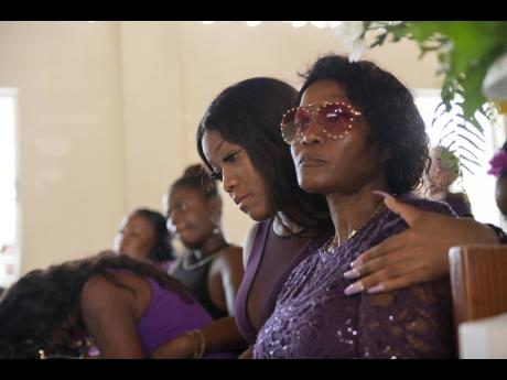 Kimone Edwards, Twayne’s sister, tries to comfort their mother, Marie Chambers Garvey.