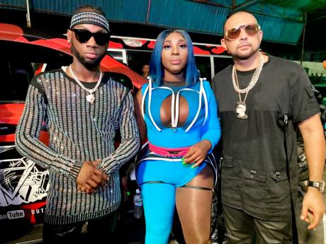 The Queen of Stage Spice is sandwiched by Dumpling original artiste Stylo G (left) and international reggae-dancehall heavy hitter Sean Paul on set of the new video. 
