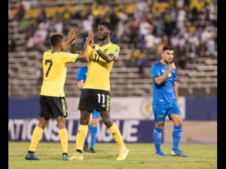 Jamaican striker Shamar Nicholson (right) celebrates after scoring against Aruba in the Concacaf Nations League match at the National Stadium in Kingston, Jamaica, on Sunday October 13, 2019.