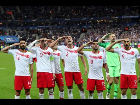 Turkey’s players salute as they celebrate a goal against France during their Euro 2020 group H qualifying match at Stade de France at Saint Denis, north of Paris, France, on Monday. Since Turkey announced its incursion into neighbouring Syria to clear out Kurdish fighters last week, patriotic sentiment has run high, with the national team players giving military salutes during international matches among the outward signs of nationalism.