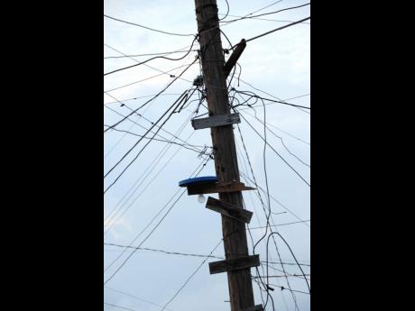 Credit: Norman Grindley Illegal connections to a Jamaica Public Service utility pole.
