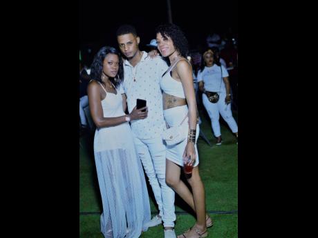 Shay (left) Chris and Sabena adhere to the all-white dress code.