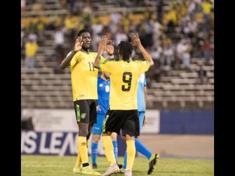 Shamar Nicholson (right) celebrates with his teammates after scoring against Aruba in the Concacaf Nations League at the National Stadium in Kingston on October 13, 2019.