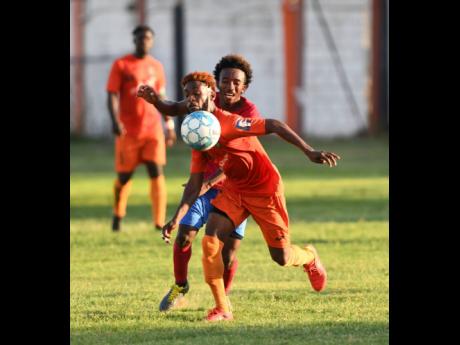 Tivoli’s Jamie Robinson moves away from Dubeholden’s Demario Phillips during their Red Stripe Premier League encounter at the Edward Seaga stadium on Sunday, October 20, 2019.