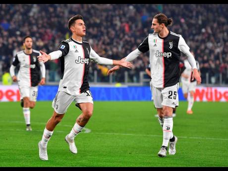 Juventus’ Paulo Dybala jubilates after scoring the goal (1-0) during the Italian Serie A match Juventus FC vs AC Milan at Allianz stadium in Turin, Italy, yesterday.
