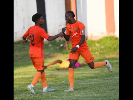 Tivoli Gardens’  Howard Morris (left) celebrates with Davion Garrison, who scores to beat Dunbeholden 1-0 in their Red Stripe Premier League encounter at the Edward Seaga Sports Complex on Sunday, October 20, 2019.