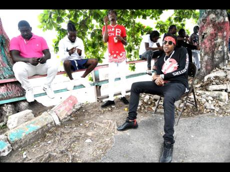 Savage (right) chats with the STAR PAR team, surrounded by his friends.