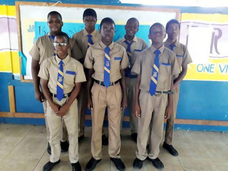Credit: Romardo Lyons Omar Lindo (back row, third right) along with classmates who decided to help him through hard times.