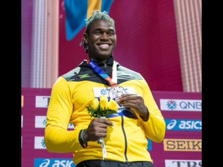 Jamaica’s Fedrick Dacres displays his discus throw silver medal after the presentation ceremony at the Khalifa International Stadium in Doha, Qatar on October 1, 2019.