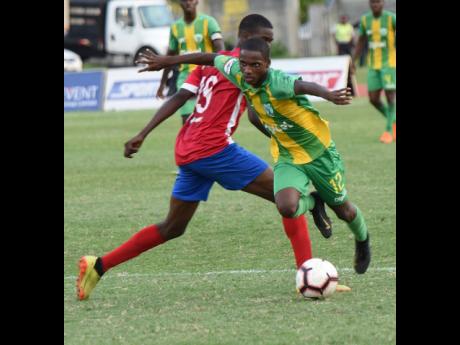 Credit: Ian Allen Ian Allen Photo
Sheldon Butler (right) from Excelsior High evades a tackle from Rasheed Grant (left) from Camperdown High during their Walker Cup semi-final football match at the national Stadium East field on November 21, 2019.