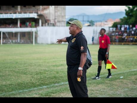Lenny Hyde instructs Falmouth United’s players from the sideline during their Western Confederation match against Montego Bay United at Jarrett Park on Sunday.