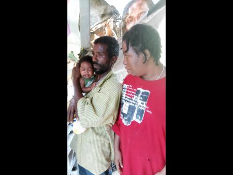 Walton Evans and his common law wife Latoya Whyte with baby Vernesha when she was about one month old.