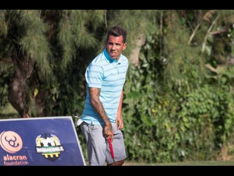 Argentine professional footballer Carlos Tevez about to hit the golf course at Tryall in Hanover, Jamaica, yesterday.