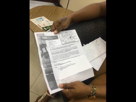 Tanaika Wint with one of the letters she collected at the post office.