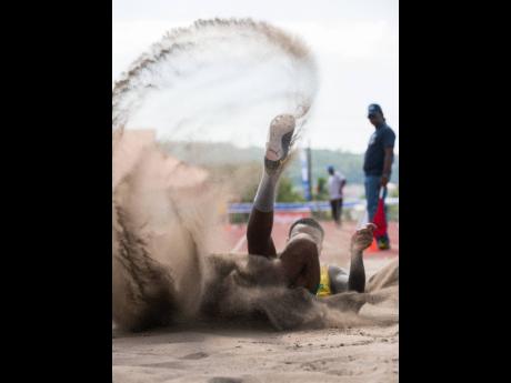 Credit: Gladstone Taylor Kavian Kerr of St Jago executes his jump as he competes in the Class One Boys’ long jump event at the Purewater/JC/R. Danny Williams Development Meet held at the Jamaica College Ashenheim Stadium in St Andrew on Saturday. Kerr won the event with a distance of 7.53m.