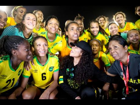 Cedella Marley (front, second right), team manager Jean Nelson (front right), and Reggae Girlz moments after the team’s victory in the international friendly against Panama at the National Stadium in Kingston on Sunday, May 19, 2019.