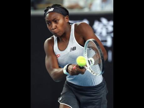 United States’ Cori “Coco” Gauff makes a backhand return to compatriot Venus Williams during their first round singles match the Australian Open tennis championship in Melbourne, Australia, on Monday.