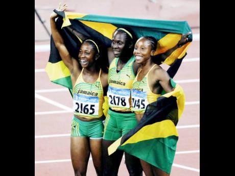 2008 Beijing Olympics 100m gold medallist Shelly-Ann Fraser (left) and joint silver medallists Kerron Stewart (centre) and Sherone Simpson.