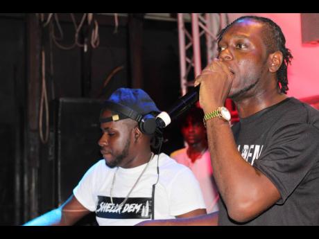 DJ Shella (left) and DJ Spugy get loud on stage.