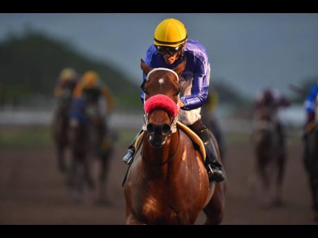UNIVERSAL BOSS (Simon Husbands) wins last Saturday’s 11th race at Caymanas Park.