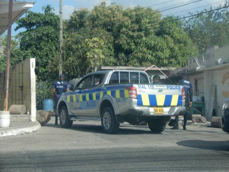 Police at the entrance of Park Lane off Red Hills Road.