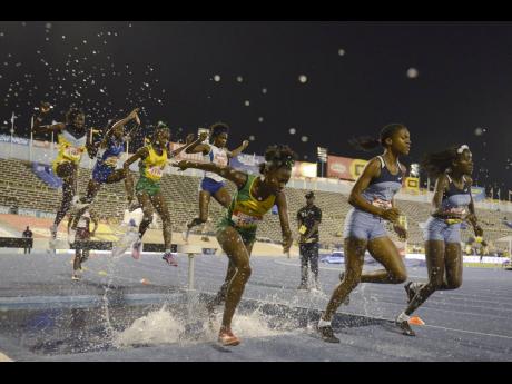 St Jago’s Jameaka Manning competes in the girls’ 2000m steeplechase with Edwin Allen High’s Kayan Green (second right) and Jeima Davis (right) at the 2017 ISSA/GraceKennedy Boys and Girls’ Championships.