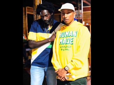 Buju Banton (left) shares this picture of himself and Pharrell Williams with his one million followers on Instagram.
