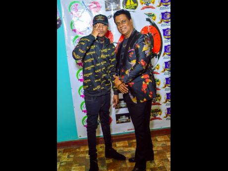 Dancehall artist Ace Gawd (left) with Percival Buddan CEO of 360 Global Entertainment.