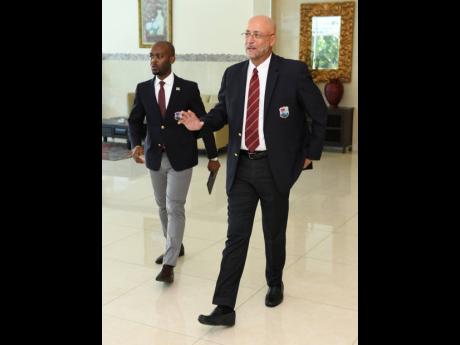 Cricket West Indies vice-president Dr Kishore Shallow (left) arrives at last year’s annual general meeting with president Ricky Skerritt at The Jamaica Pegasus hotel.