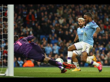 Manchester City’s Raheem Sterling (right) scores a goal disallowed for offside during the English League Cup semi-final second-leg match between Manchester City and Manchester United at Etihad stadium in Manchester, England, January 29, 2020. 