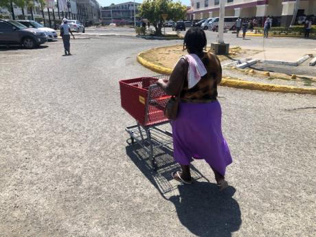 After securing a trolley, Barbara Bryan heads to join the long line at Mega Mart.