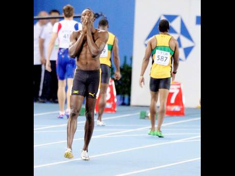 Usain Bolt reacts after he false-started in the men’s 100m final at the World Championships in 2011.